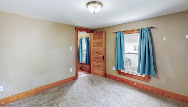 26 Walnut Ct, Mogadore, OH 44260 - carpeted empty room featuring baseboards