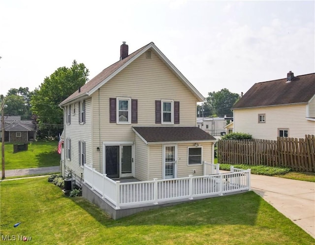 26 Walnut Ct, Mogadore, OH 44260 - rear view of house featuring a chimney and a wooden deck