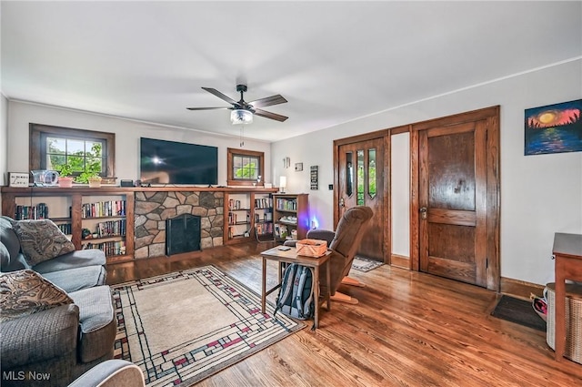 1754 Edgewood St NE, Warren, OH 44483 - living area with wood finished floors, ceiling fan, and a fireplace