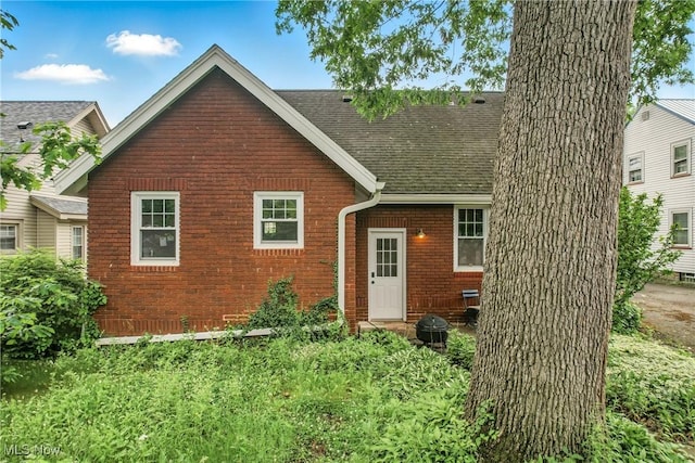 1754 Edgewood St NE, Warren, OH 44483 - view of front of property featuring a shingled roof and brick siding