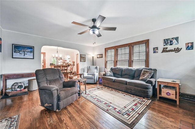 1754 Edgewood St NE, Warren, OH 44483 - living area with arched walkways, a chandelier, a ceiling fan, and wood finished floors