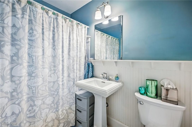 1754 Edgewood St NE, Warren, OH 44483 - bathroom with a wainscoted wall and a shower with shower curtain