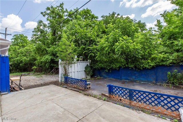 12604 Saint John Ave, Cleveland, OH 44111 - fenced backyard featuring a patio area