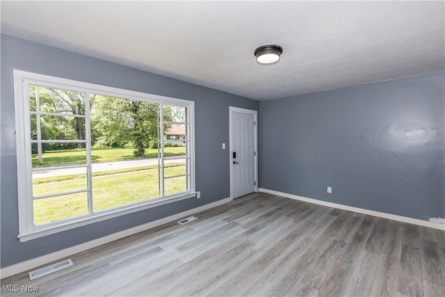 12604 Saint John Ave, Cleveland, OH 44111 - unfurnished room with wood finished floors and baseboards