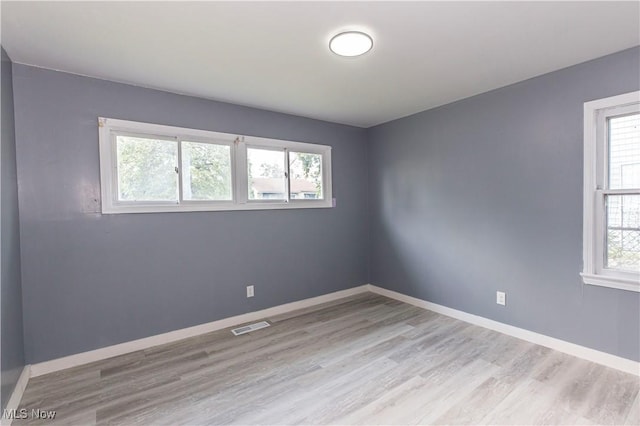 12604 Saint John Ave, Cleveland, OH 44111 - unfurnished room featuring light wood-style floors and baseboards