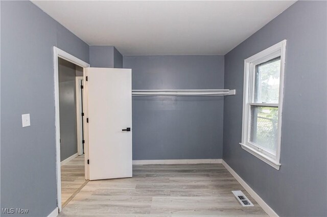 12604 Saint John Ave, Cleveland, OH 44111 - unfurnished bedroom with wood finished floors and baseboards