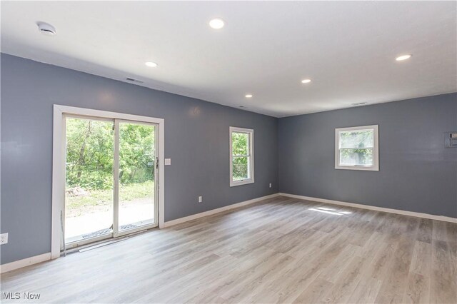 12604 Saint John Ave, Cleveland, OH 44111 - empty room featuring plenty of natural light, recessed lighting, a smoke detector, and light wood-style flooring