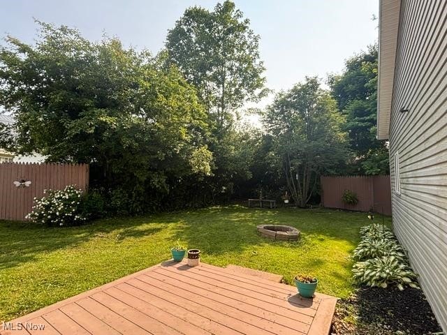 967 Lincoln St, Wooster, OH 44691 - view of yard with a fire pit and a wooden deck