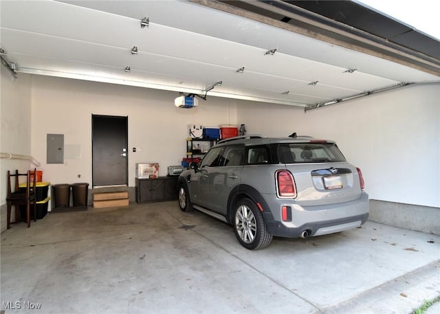 604 Marquardt Ave, Cleveland, OH 44113 - garage featuring electric panel and a garage door opener