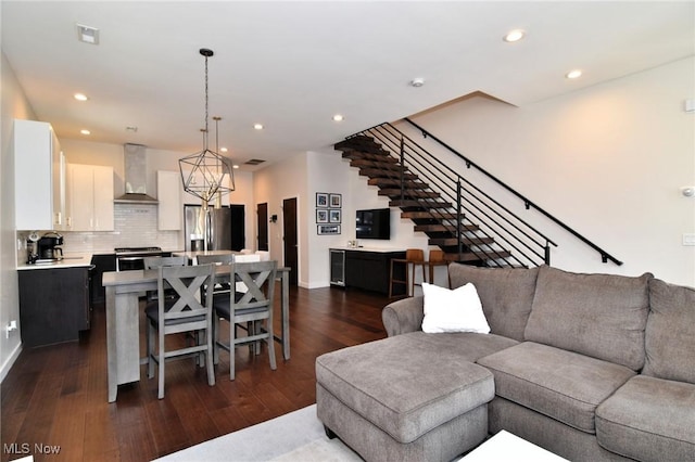 604 Marquardt Ave, Cleveland, OH 44113 - living area with dark wood-style flooring, recessed lighting, and stairs