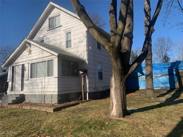 2005 Liberty Rd, Stow, OH 44224 - view of side of property featuring a lawn and crawl space