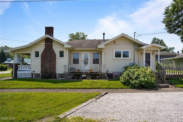608 S 14th St, Sebring, OH 44672 - back of property with a chimney and a lawn