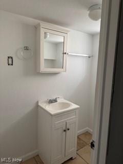 5357 Beechwood Ave, Maple Heights, OH 44137 - bathroom with vanity and tile patterned floors