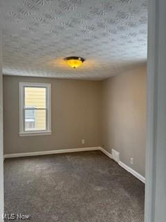 5357 Beechwood Ave, Maple Heights, OH 44137 - unfurnished room with carpet flooring and a textured ceiling