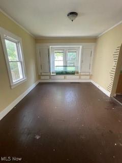 4313 Wichita Ave, Cleveland, OH 44109 - empty room with ornamental molding and dark wood finished floors