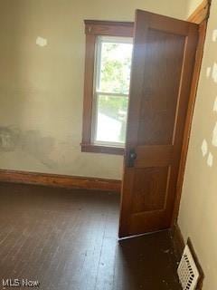 4313 Wichita Ave, Cleveland, OH 44109 - entryway with baseboards and dark wood-style floors
