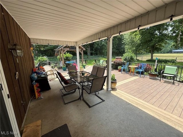 22399 Township Rd Unit 1203, West Lafayette, OH 43845 - view of patio featuring outdoor dining area and a wooden deck