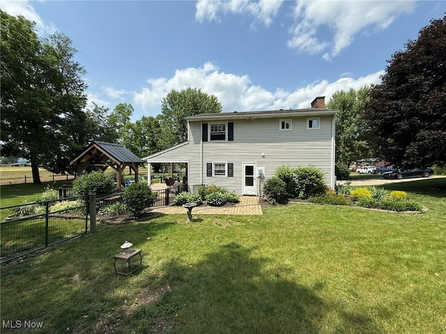 22399 Township Rd Unit 1203, West Lafayette, OH 43845 - back of property featuring a gazebo and a chimney
