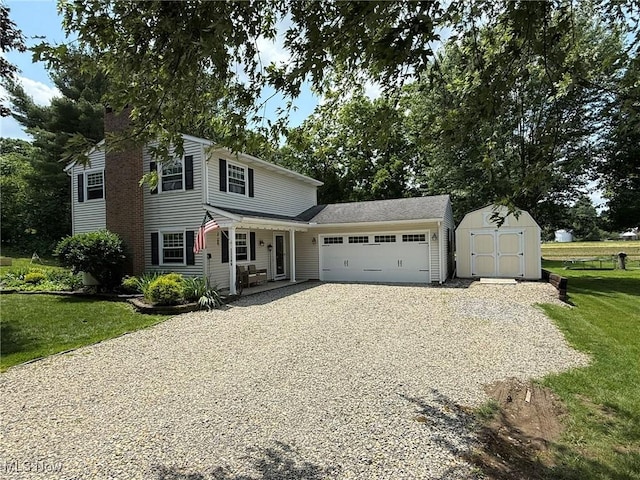 22399 Township Rd Unit 1203, West Lafayette, OH 43845 - traditional-style house featuring driveway, a garage, a storage unit, a front yard, and a chimney