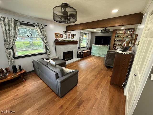 22399 Township Rd Unit 1203, West Lafayette, OH 43845 - living area with a ceiling fan, crown molding, a fireplace, wood finished floors, and recessed lighting