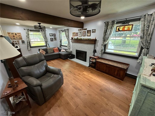 22399 Township Rd Unit 1203, West Lafayette, OH 43845 - living area with a ceiling fan, a fireplace, wood finished floors, recessed lighting, and crown molding