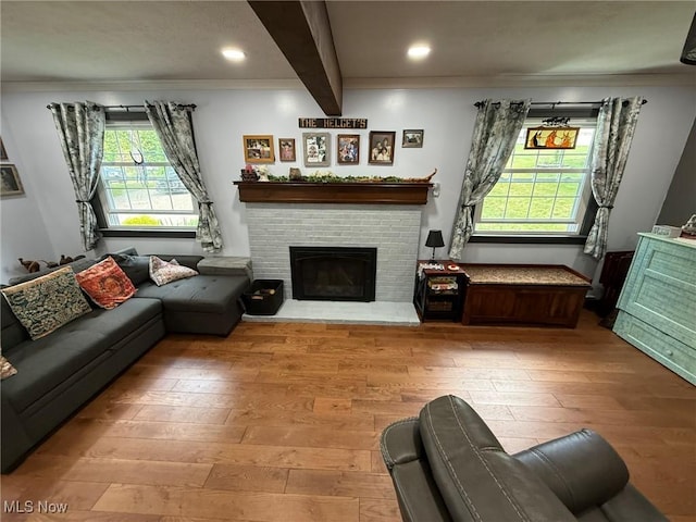 22399 Township Rd Unit 1203, West Lafayette, OH 43845 - living area featuring wood-type flooring, beam ceiling, recessed lighting, a fireplace, and ornamental molding