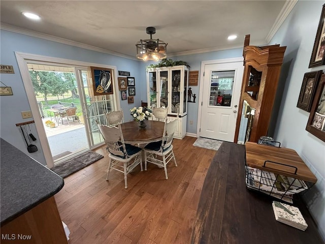22399 Township Rd Unit 1203, West Lafayette, OH 43845 - dining room featuring wood finished floors, crown molding, and recessed lighting
