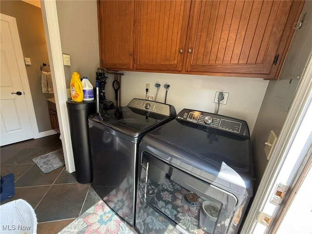 22399 Township Rd Unit 1203, West Lafayette, OH 43845 - laundry room with separate washer and dryer, cabinet space, and dark tile patterned flooring