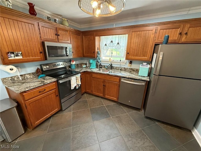 22399 Township Rd Unit 1203, West Lafayette, OH 43845 - kitchen featuring stainless steel appliances, brown cabinets, light stone counters, and ornamental molding