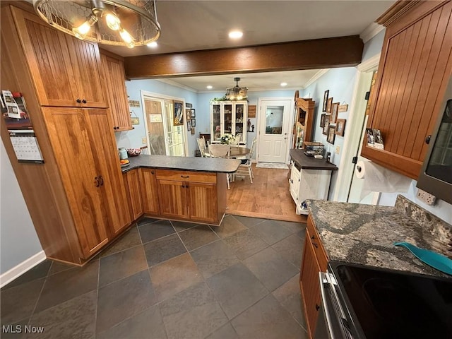 22399 Township Rd Unit 1203, West Lafayette, OH 43845 - kitchen with dark countertops, brown cabinets, crown molding, and recessed lighting