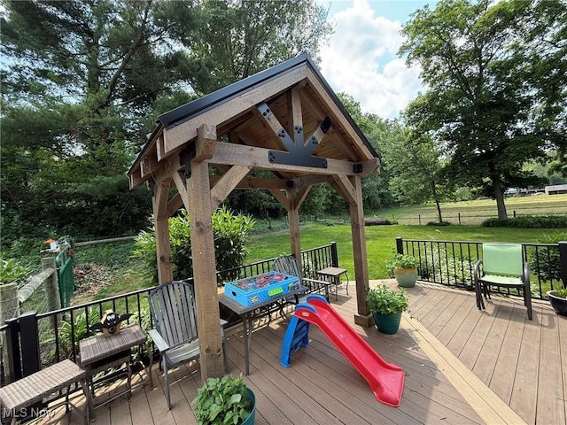 22399 Township Rd Unit 1203, West Lafayette, OH 43845 - deck featuring a lawn, a gazebo, view of scattered trees, and outdoor dining space