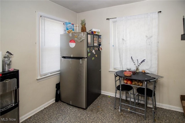 14112 Rockside Rd, Maple Heights, OH 44137 - kitchen with freestanding refrigerator and baseboards