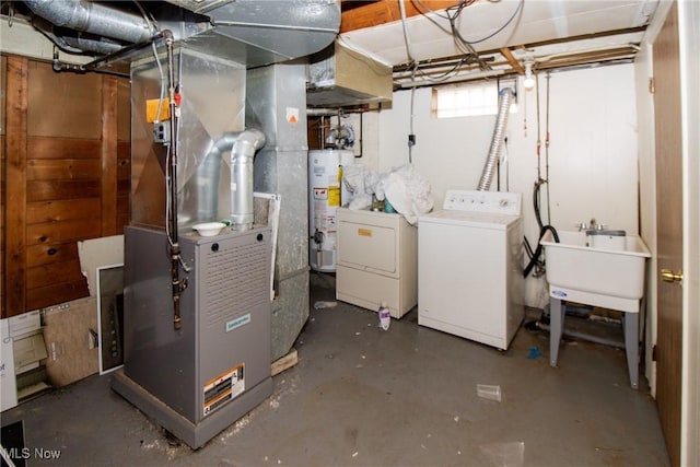 14112 Rockside Rd, Maple Heights, OH 44137 - below grade area featuring water heater, heating unit, and separate washer and dryer