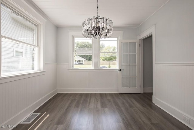 381 Watson St, Akron, OH 44305 - unfurnished dining area featuring a chandelier, dark wood-style flooring, a wainscoted wall, and crown molding