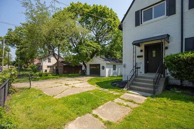381 Watson St, Akron, OH 44305 - view of yard with an outdoor structure and driveway