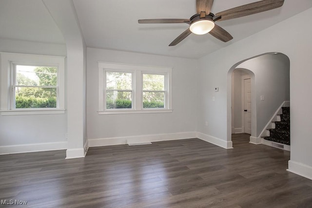 381 Watson St, Akron, OH 44305 - unfurnished room with healthy amount of natural light, stairway, arched walkways, and a ceiling fan