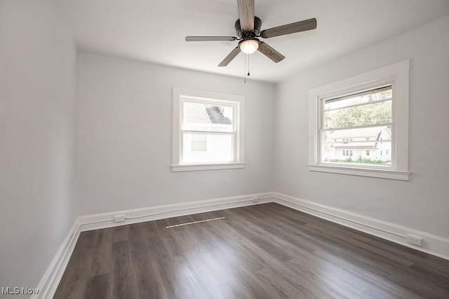 381 Watson St, Akron, OH 44305 - spare room featuring plenty of natural light, a ceiling fan, and dark wood-type flooring