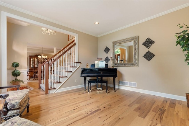 1588 Eagle Watch St NE, Canton, OH 44721 - living area with a chandelier, wood finished floors, stairs, crown molding, and recessed lighting