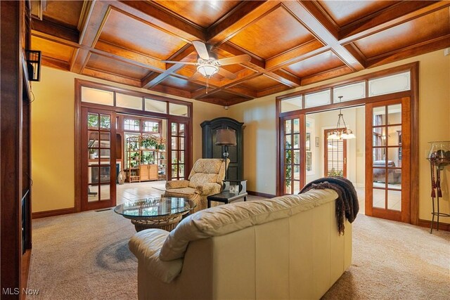 1588 Eagle Watch St NE, Canton, OH 44721 - living area featuring light colored carpet, french doors, a ceiling fan, beam ceiling, and coffered ceiling
