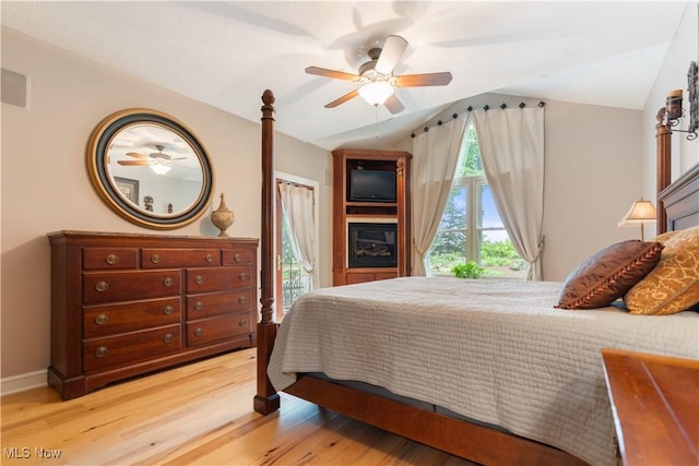 1588 Eagle Watch St NE, Canton, OH 44721 - bedroom with lofted ceiling, access to exterior, light wood-type flooring, and ceiling fan
