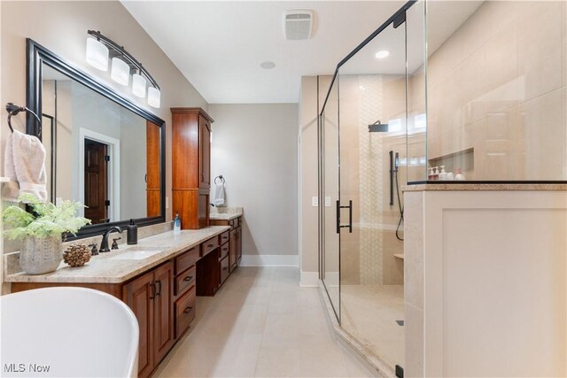 1588 Eagle Watch St NE, Canton, OH 44721 - bathroom with a shower stall, vanity, and tile patterned floors