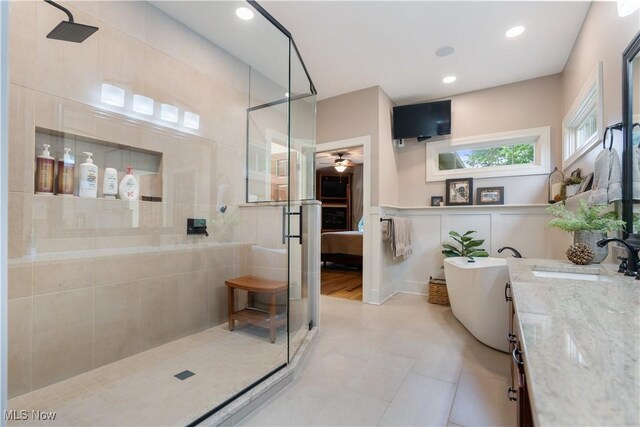 1588 Eagle Watch St NE, Canton, OH 44721 - bathroom with a ceiling fan, a tile shower, vanity, a freestanding tub, and ensuite bathroom