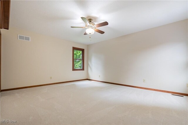 1588 Eagle Watch St NE, Canton, OH 44721 - empty room with a ceiling fan and light colored carpet