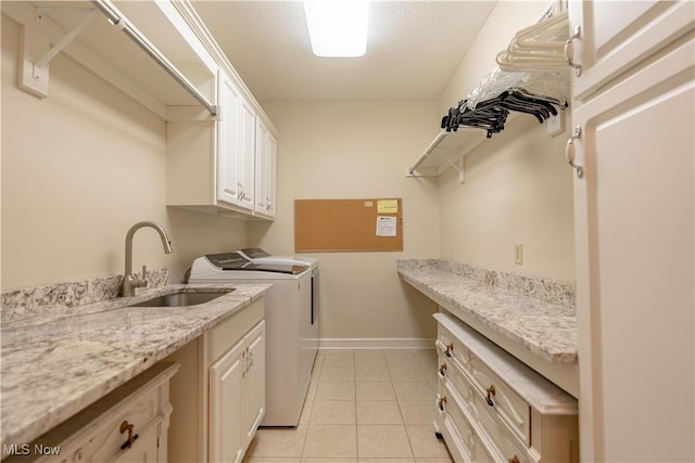 1588 Eagle Watch St NE, Canton, OH 44721 - washroom featuring cabinet space, independent washer and dryer, and light tile patterned floors
