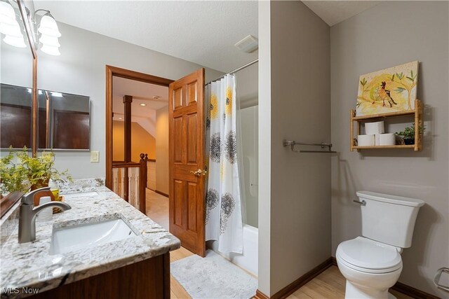1588 Eagle Watch St NE, Canton, OH 44721 - full bathroom with double vanity, wood finished floors, and shower / bath combination with curtain