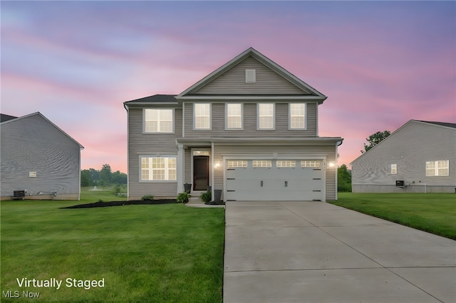 1633 Duncan Way, Streetsboro, OH 44241 - traditional-style home with a front yard, concrete driveway, and a garage