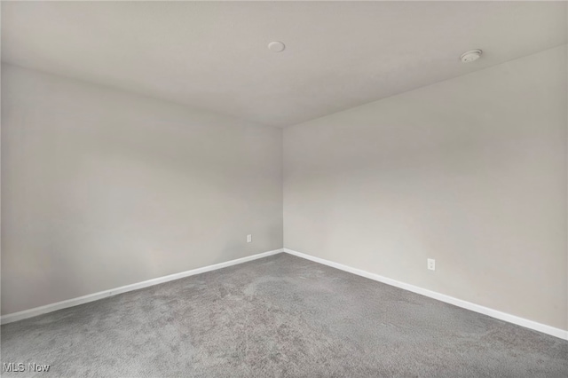 1633 Duncan Way, Streetsboro, OH 44241 - carpeted empty room featuring a smoke detector and baseboards