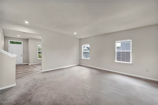 1633 Duncan Way, Streetsboro, OH 44241 - empty room featuring carpet floors, recessed lighting, and plenty of natural light