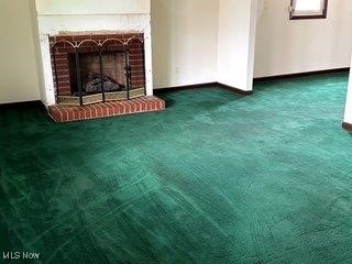 1531 E 290th St, Wickliffe, OH 44092 - unfurnished living room with carpet flooring and a brick fireplace