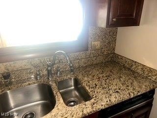 1531 E 290th St, Wickliffe, OH 44092 - kitchen view of dark brown cabinetry and light stone counters